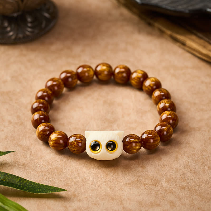 Buddha Stones Bransoletka z żółtymi koralikami z żywicy i kości słoniowej z motywem mądrości kota